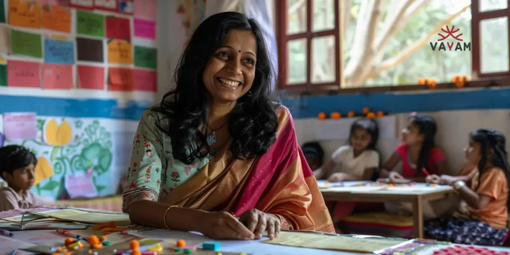 A woman smiles while teaching in a classroom, promoting the Right to Education in India for free schooling opportunities.