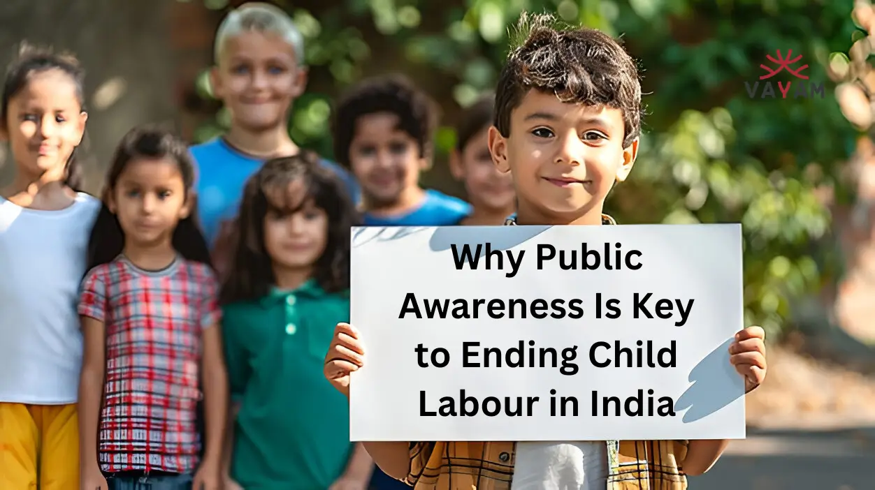 A group of volunteers holding banners and posters during a child labour awareness campaign.