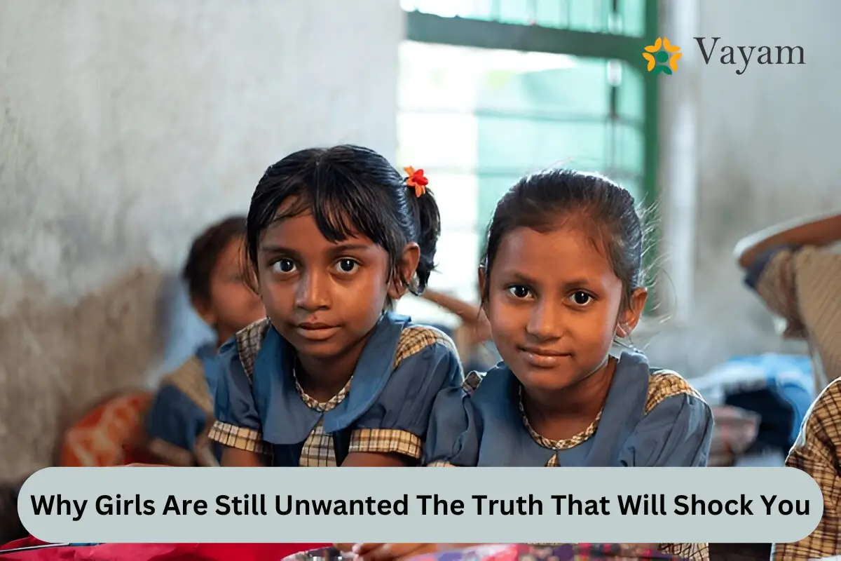 Two young girls seated in a classroom, engaged with their books, highlighting the importance of education for all children.