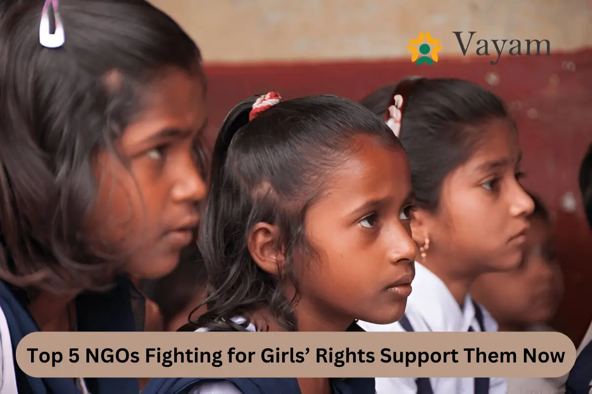 A group of young girls engaged in learning together in a classroom setting, highlighting the importance of education for girls.