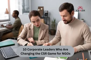 A man and woman study a map on a desk, symbolizing collaboration in CSR initiatives for NGOs.