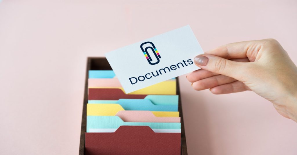 Folder with documents for MGNREGA job card renewal.