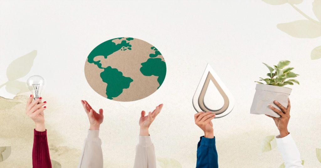 Hands hold a paper globe adorned with plants and a light bulb, symbolizing CSR values and sustainable practices.