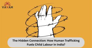 A hand bound with barbed wire, symbolizing the harsh realities of human trafficking and its link to child labour in India.