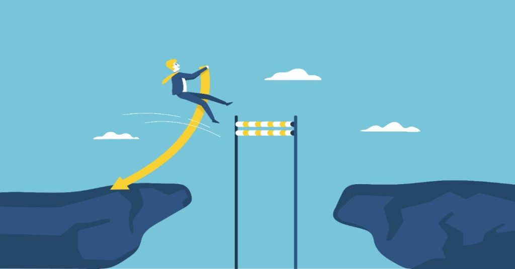 Businessman climbing a cliff, symbolizing NGO faces challenges on the path to partnership.